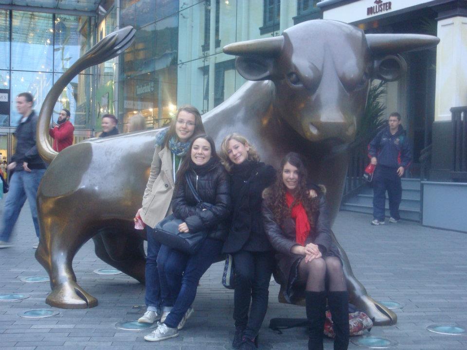 Virginie with friends at the Bullring bull statue in Birmingham, UK